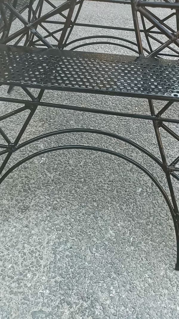 Detail: bent arches and perforated sheet.